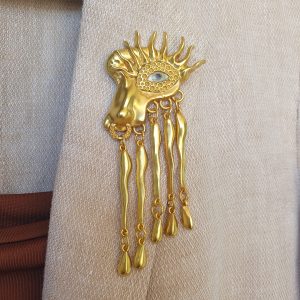 Statement brooch with cascading pendants